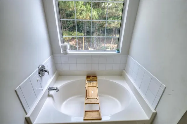 a room with a bed and a chandelier