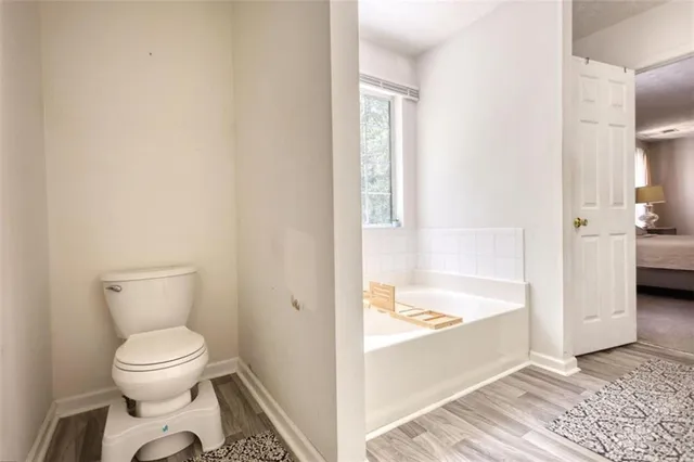 a bedroom with a bed and a mirror