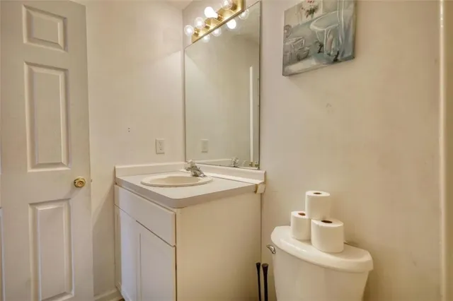 a view of a patio with table and chairs and floor to ceiling window and wooden fence