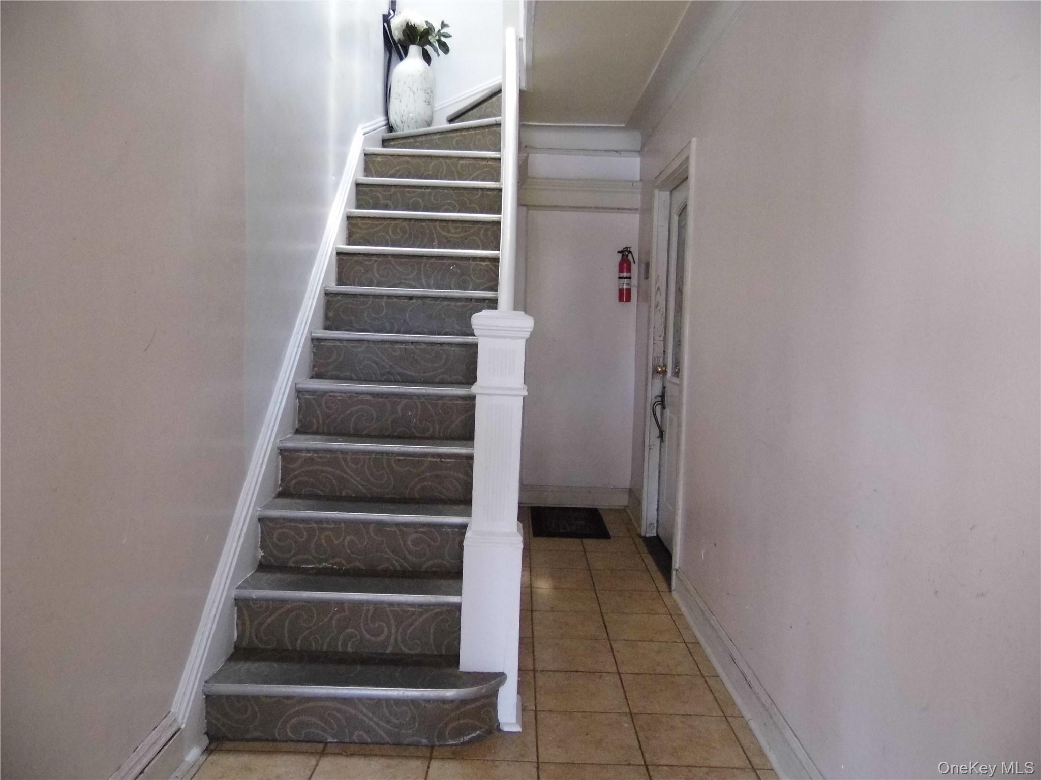 86-75 80th Street Queens, NY 11421 - Photo 14 of 20 a view of an entryway with stairs