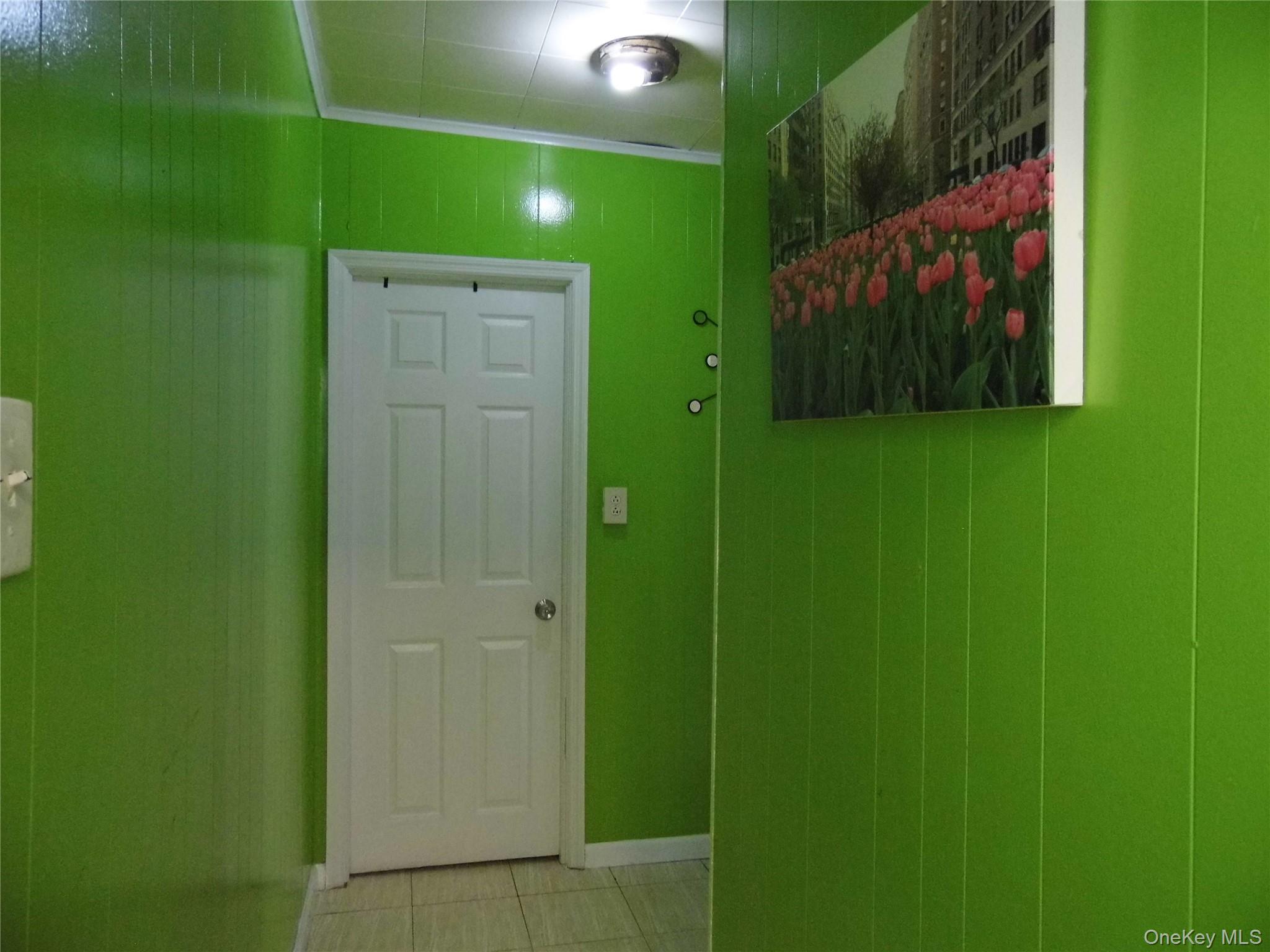 86-75 80th Street Queens, NY 11421 - Photo 8 of 20 a bathroom with a shower and a sink