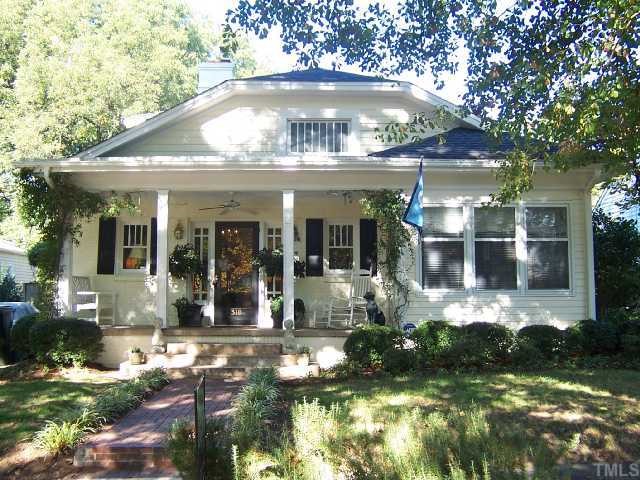 310 Morrison Avenue Raleigh, NC 27608 - Photo 1 of 12 a front view of a house with a yard