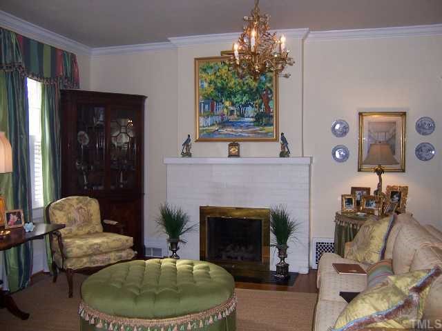 310 Morrison Avenue Raleigh, NC 27608 - Photo 2 of 12 a living room with furniture and a fireplace