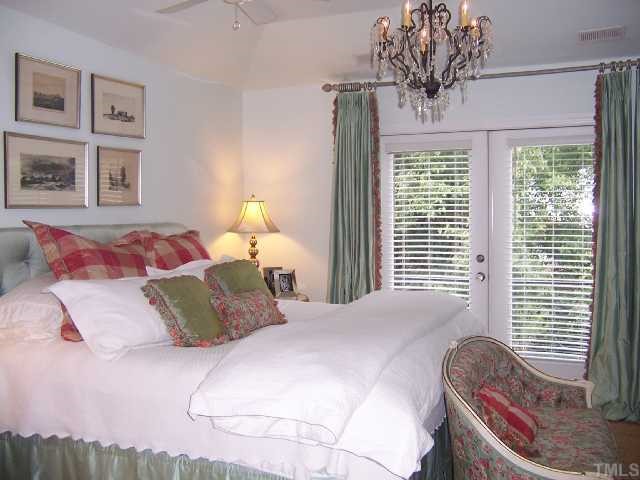 310 Morrison Avenue Raleigh, NC 27608 - Photo 8 of 12 a bedroom with a bed and a window