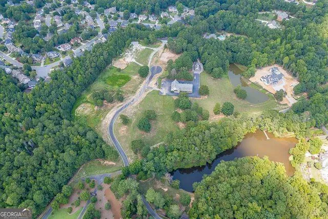an aerial view of residential house with outdoor space and swimming pool