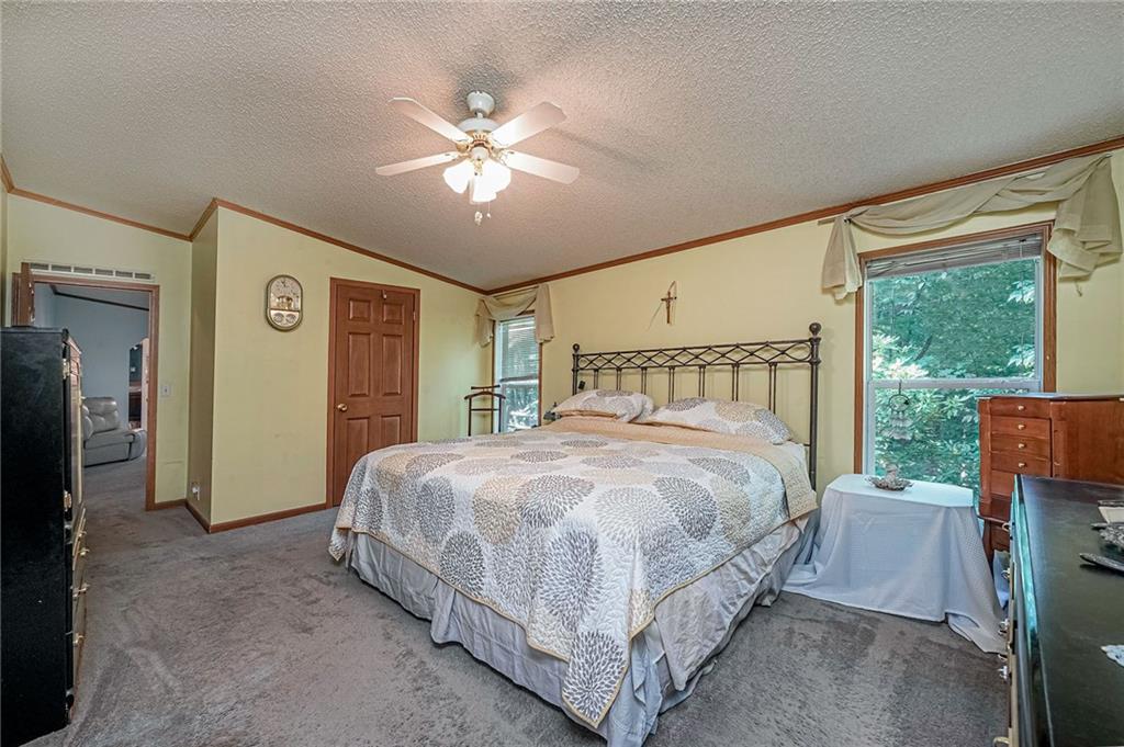 178 Whiteshill Road Rochester, PA 15074 - Photo 20 of 38 a bedroom with a bed and a large mirror