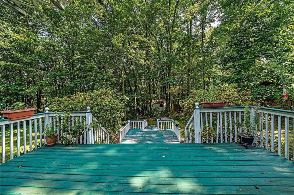 178 Whiteshill Road Rochester, PA 15074 - Photo 29 of 38 a view of a wooden deck and a big yard