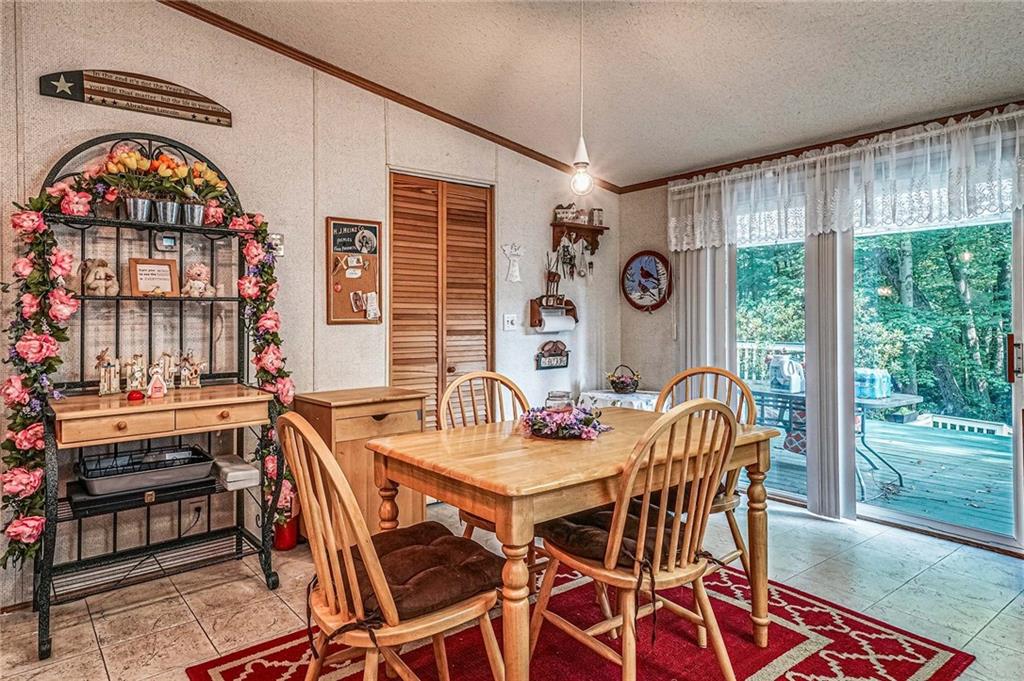 178 Whiteshill Road Rochester, PA 15074 - Photo 8 of 38 a view of a dining room with furniture wooden floor and a rug