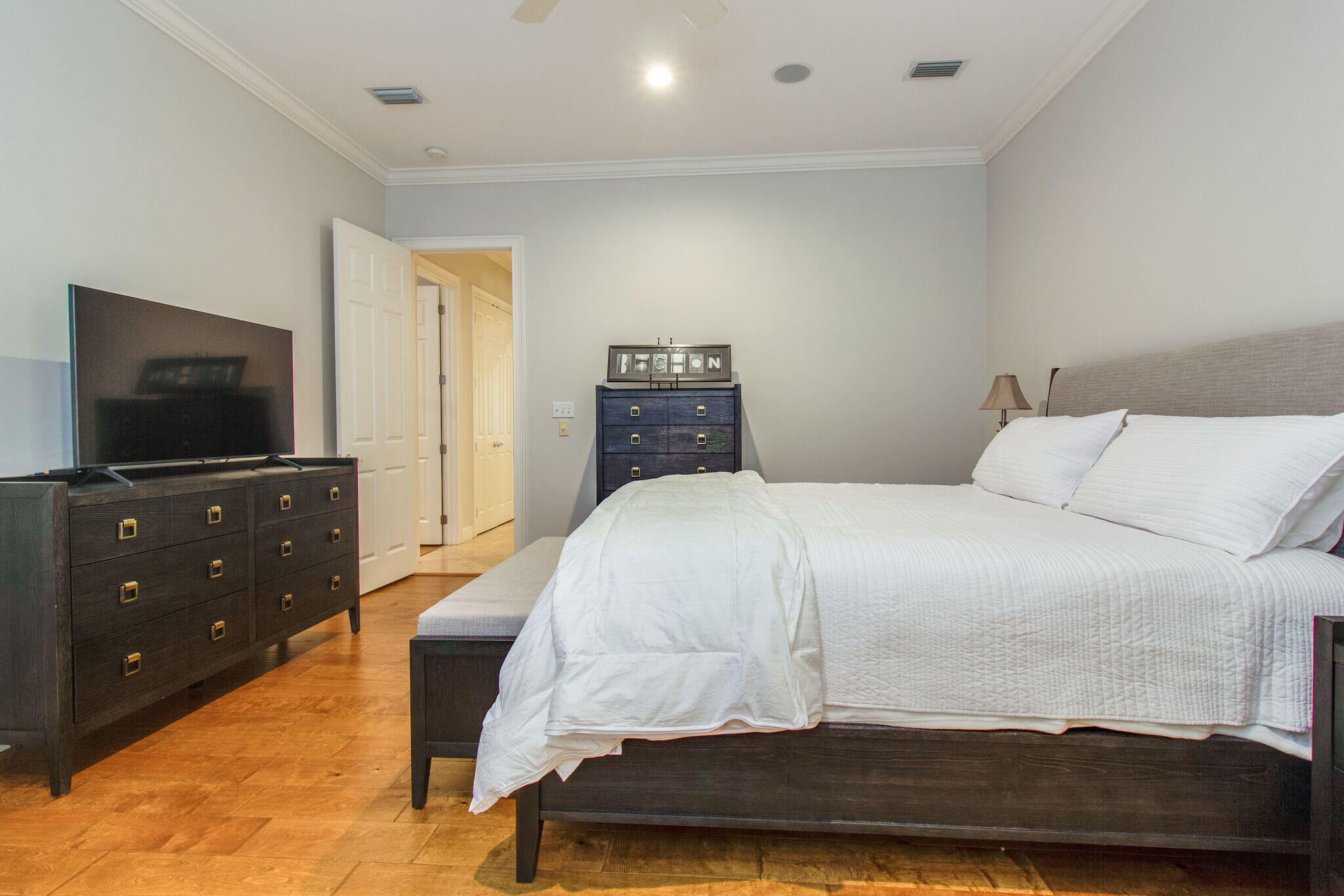 2113 Clipper Cove Miramar Beach, FL 32550 - Photo 13 of 29 a bedroom with a bed and a flat screen tv