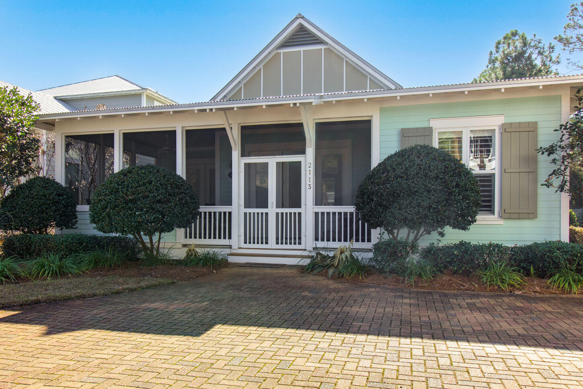 2113 Clipper Cove Miramar Beach, FL 32550 - Photo 2 of 29 a front view of a house with a yard