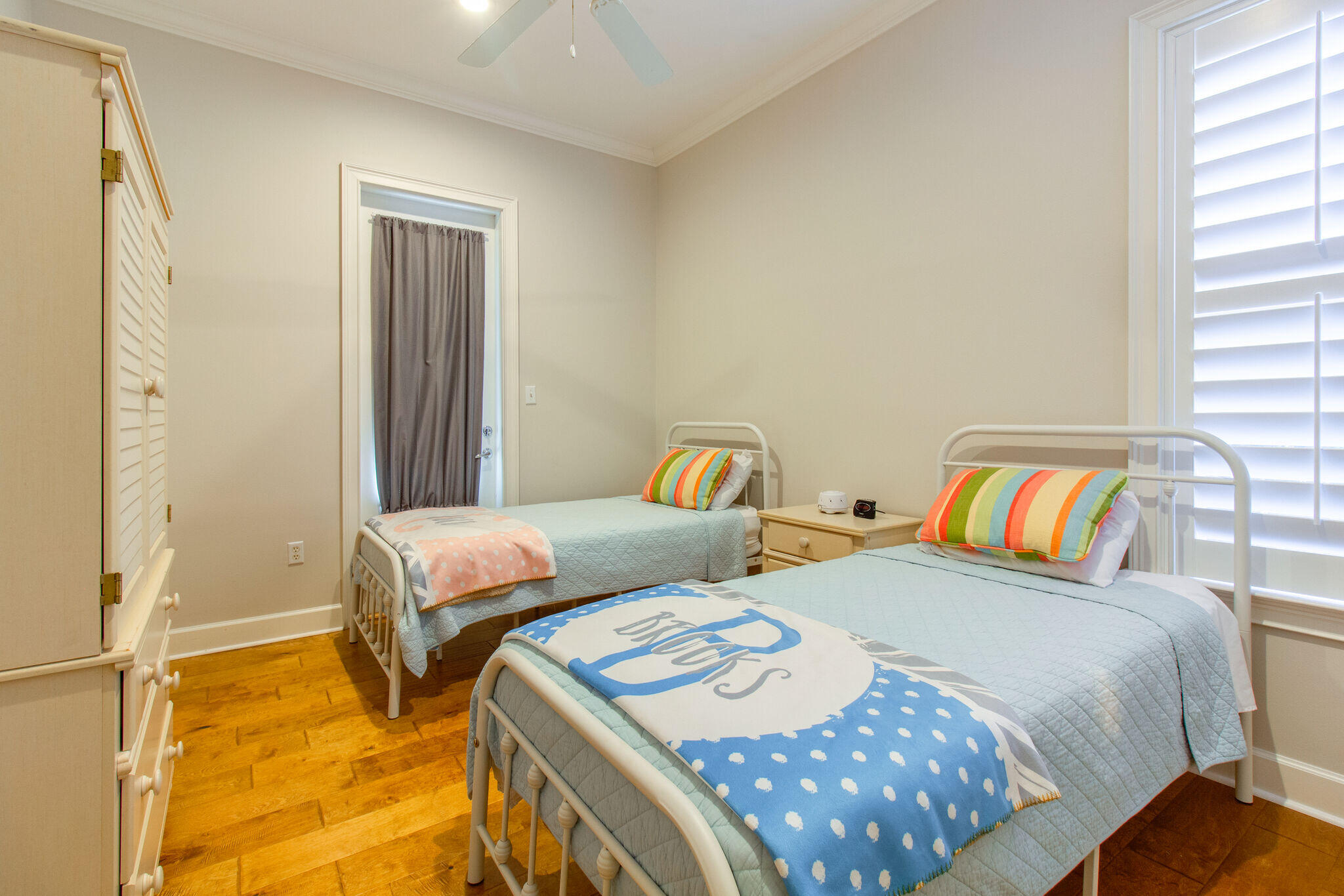 2113 Clipper Cove Miramar Beach, FL 32550 - Photo 21 of 29 a bedroom with two beds and painted walls