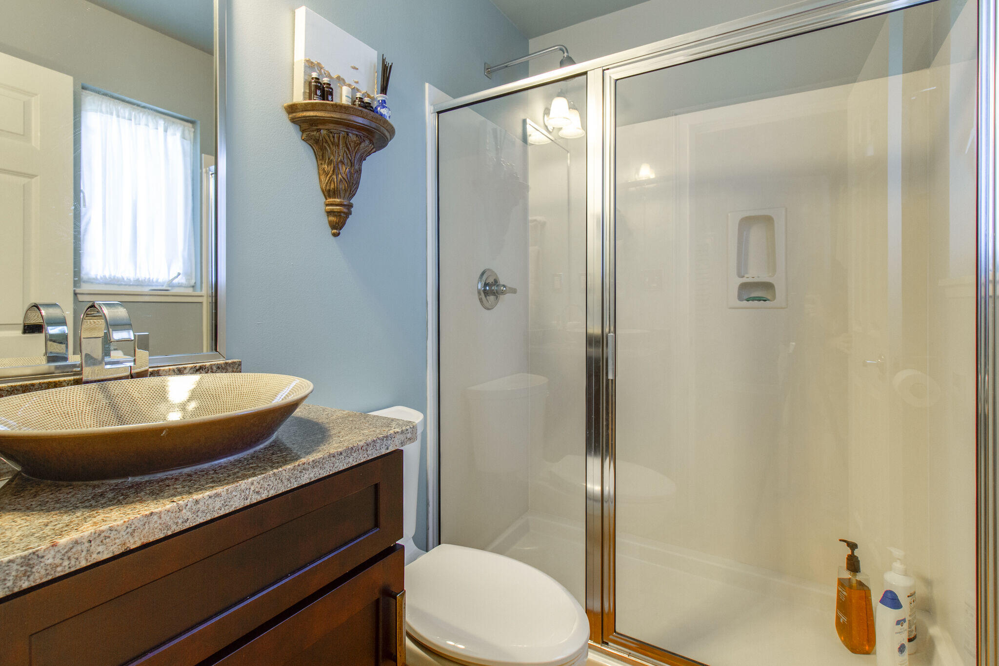 2113 Clipper Cove Miramar Beach, FL 32550 - Photo 25 of 29 a bathroom with a granite countertop sink a toilet and shower