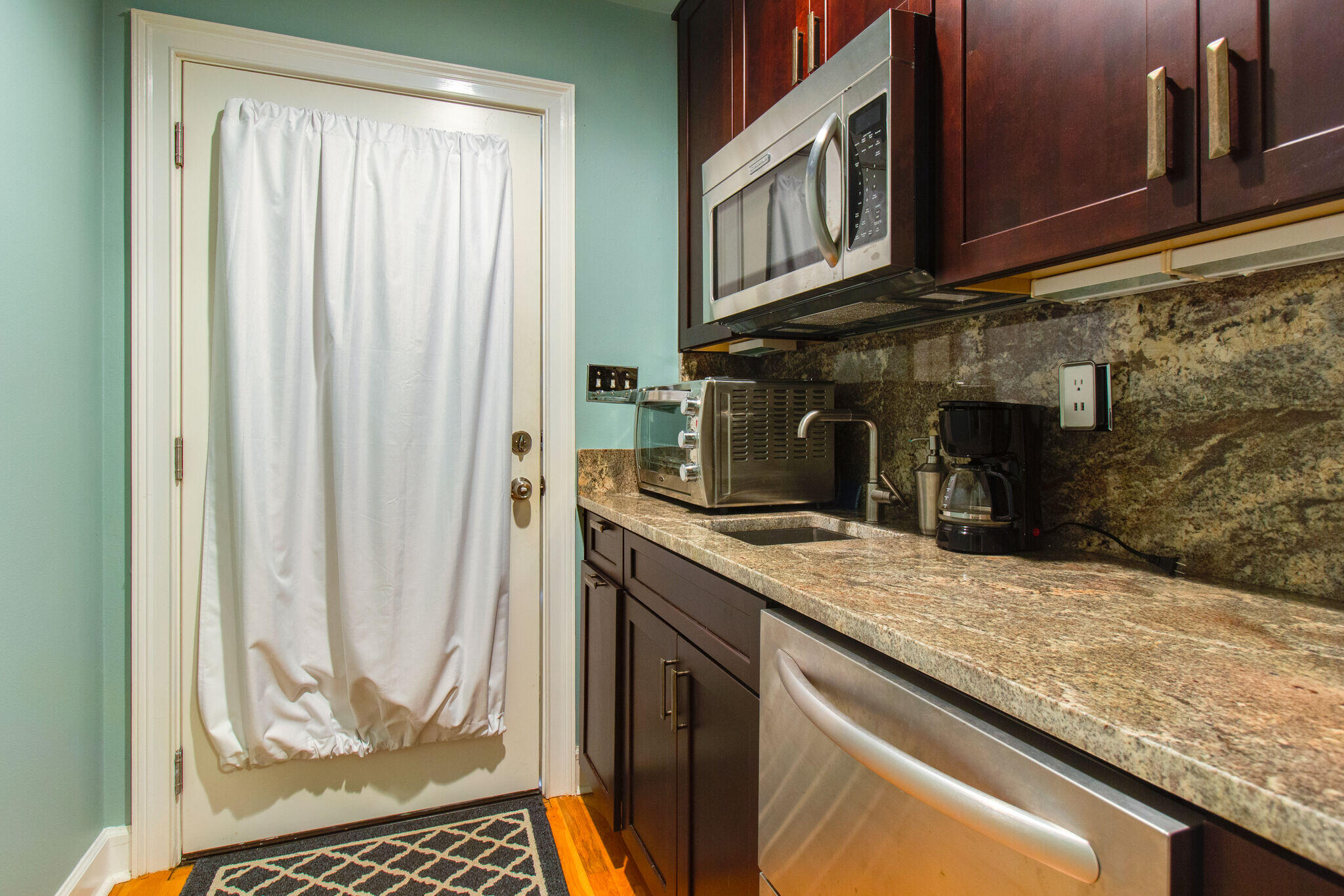 2113 Clipper Cove Miramar Beach, FL 32550 - Photo 26 of 29 a kitchen with granite countertop a sink and a stove