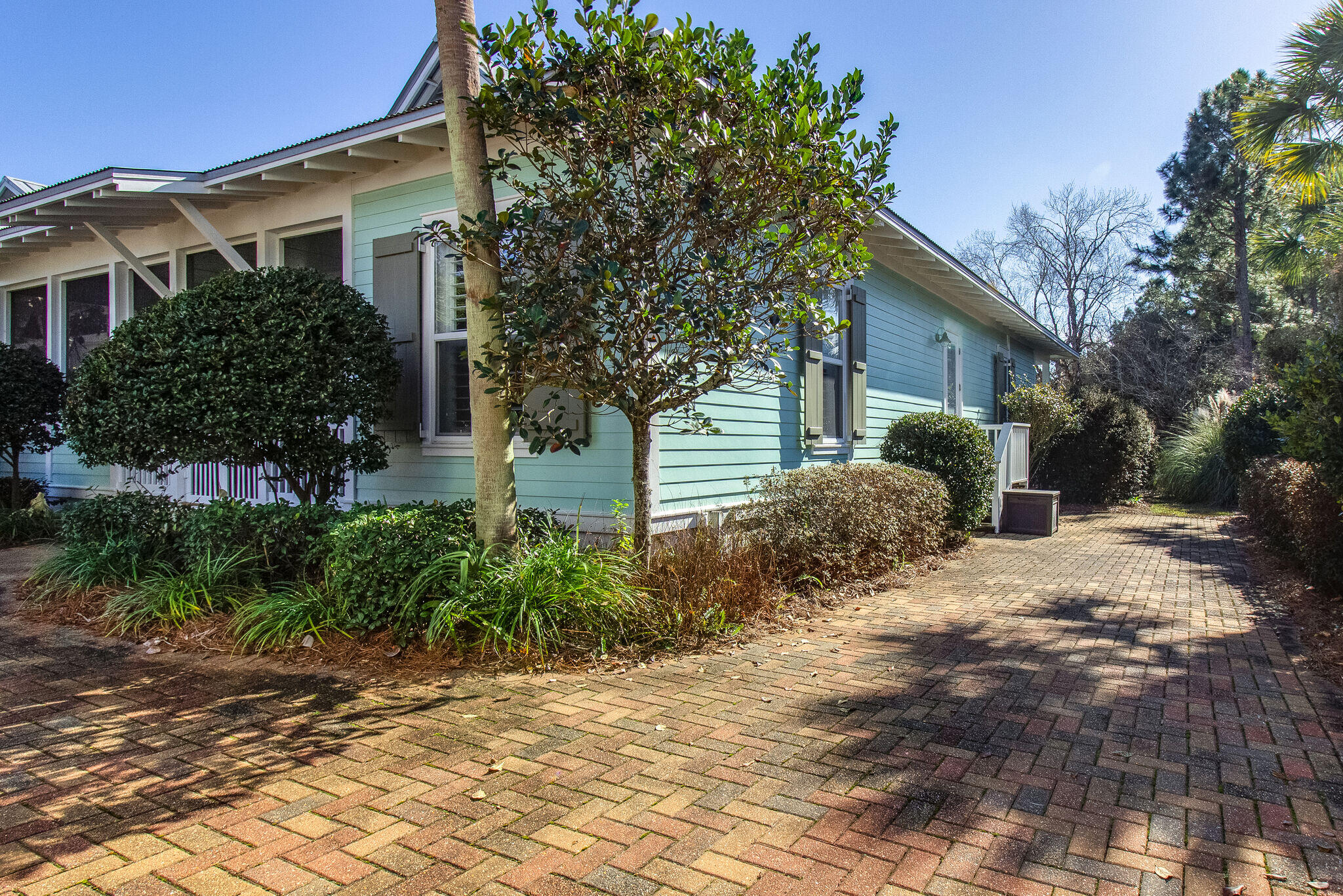 2113 Clipper Cove Miramar Beach, FL 32550 - Photo 27 of 29 a front view of a house with garden
