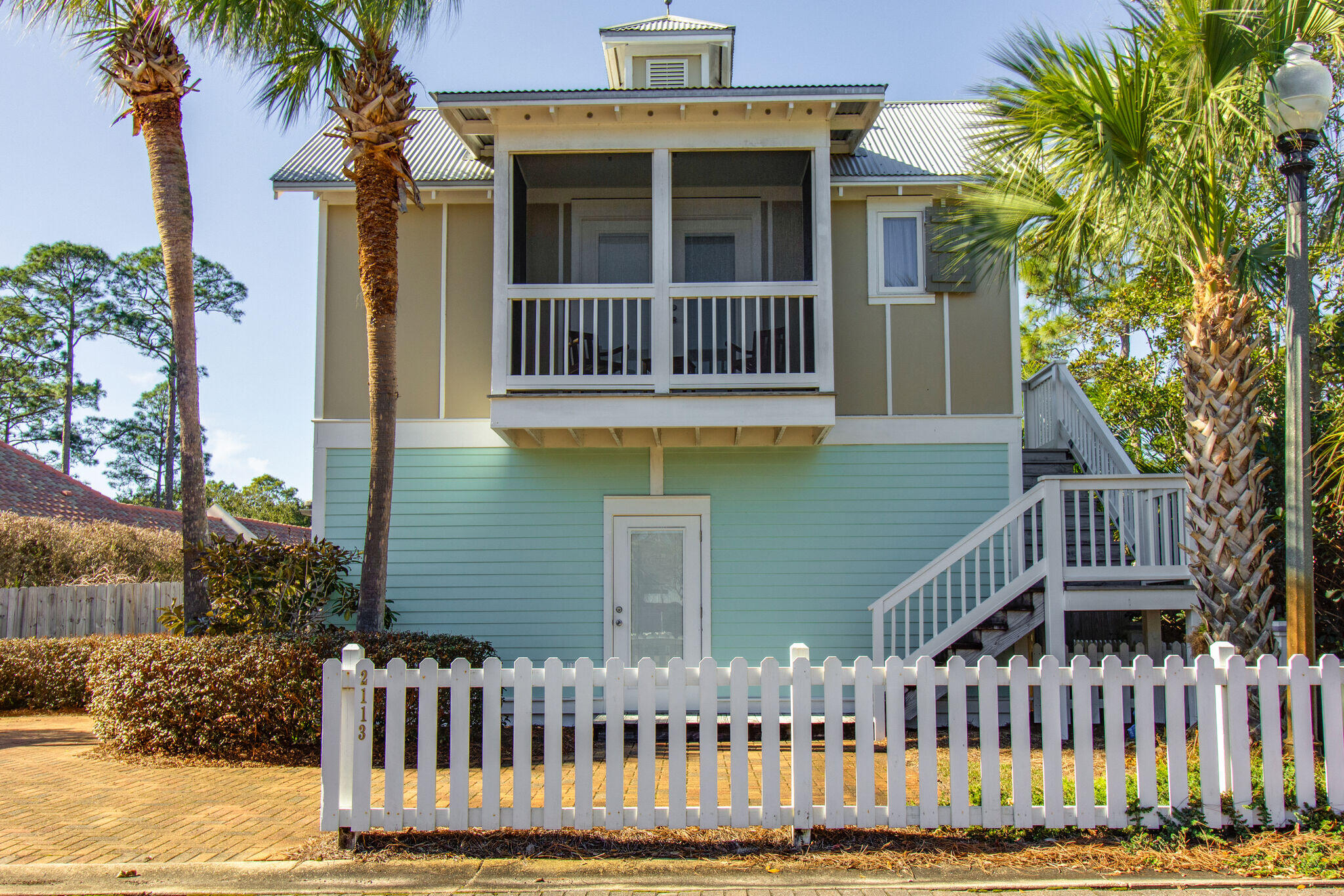 2113 Clipper Cove Miramar Beach, FL 32550 - Photo 3 of 29 a front view of a house with a yard