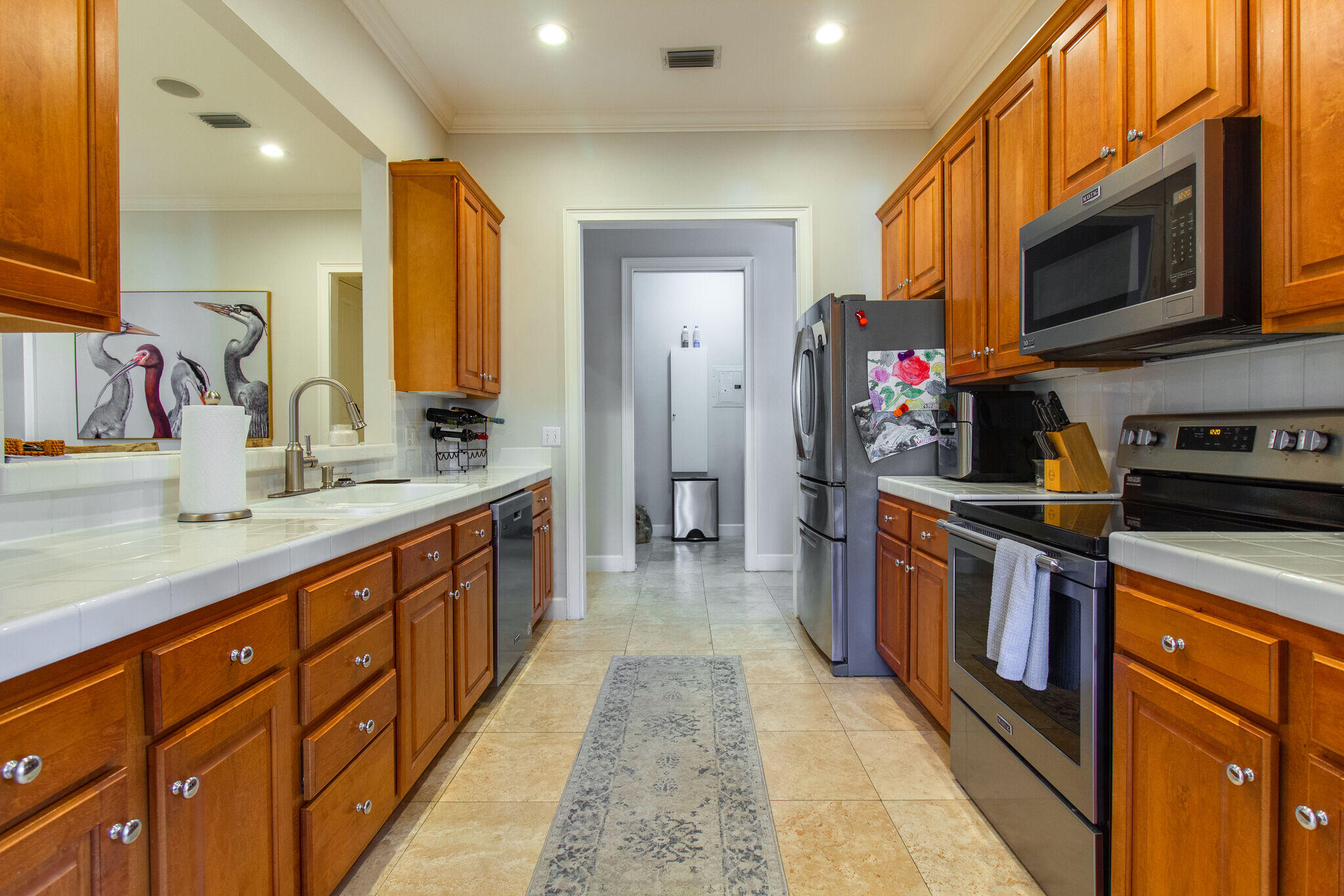 2113 Clipper Cove Miramar Beach, FL 32550 - Photo 10 of 29 a large kitchen with stainless steel appliances granite countertop a large counter top a stove and a sink