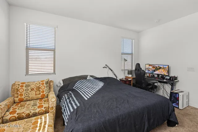 a bedroom with bed and a window