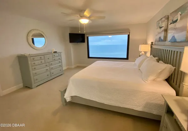 a spacious bathroom with a granite countertop sink mirror and shower