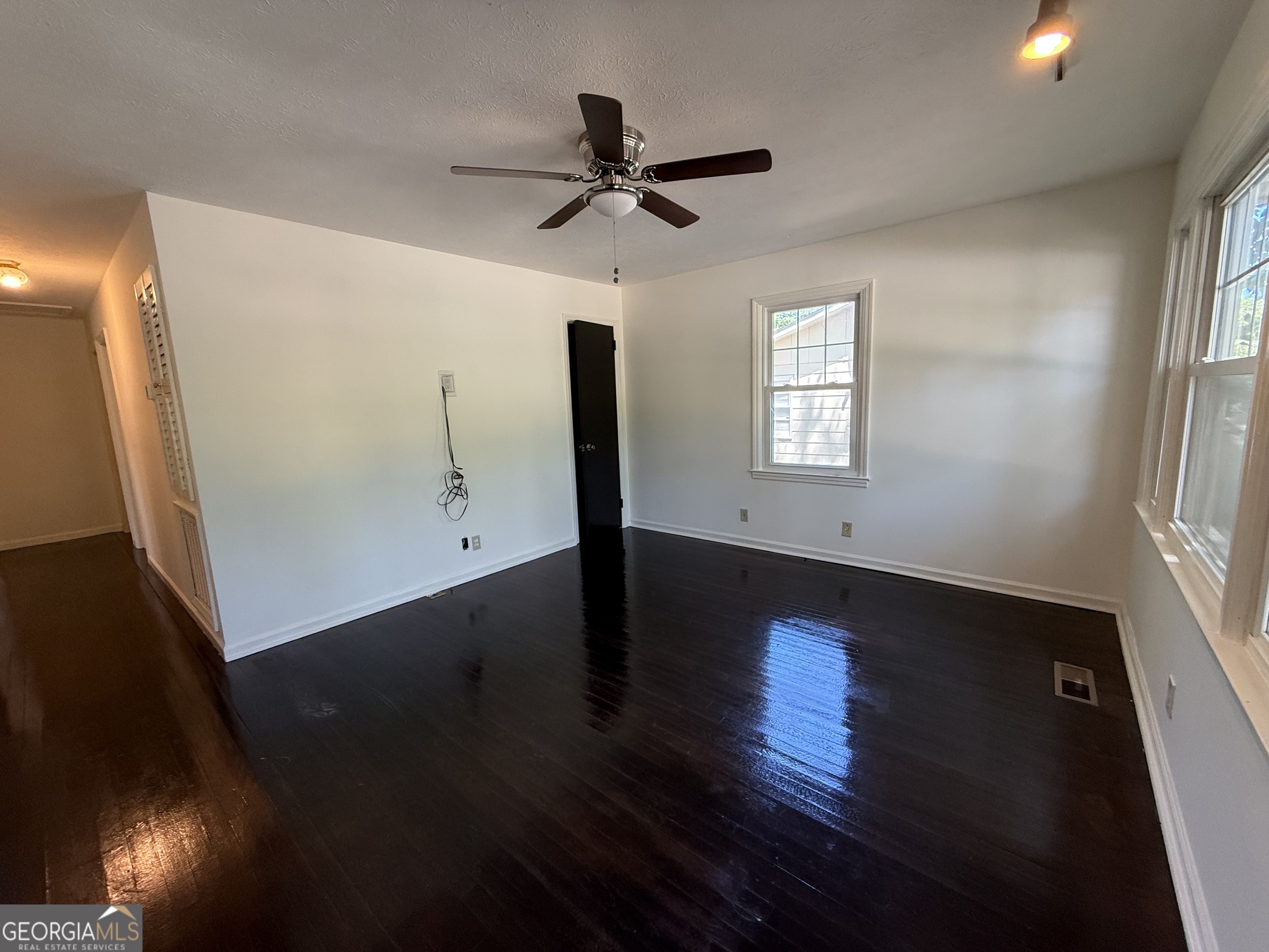 179 Youngs Mill Road LaGrange, GA 30241 - Photo 8 of 30 a view of empty room with wooden floor and fan