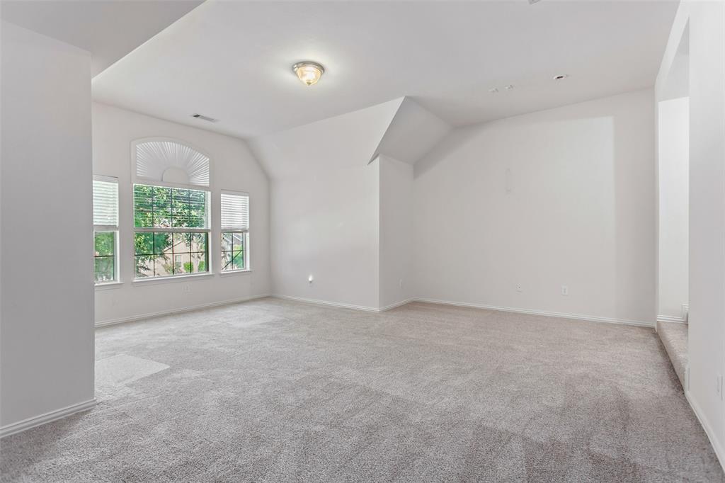 915 Falcon Trail Murphy, TX 75094 - Photo 15 of 22 an empty room with windows and closet