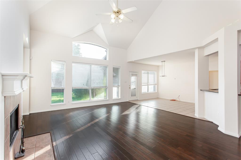 915 Falcon Trail Murphy, TX 75094 - Photo 19 of 40 a view of an empty room with wooden floor and a window
