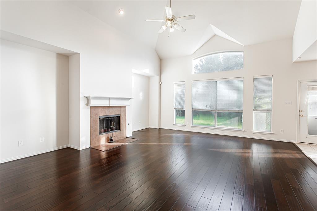 915 Falcon Trail Murphy, TX 75094 - Photo 24 of 40 a view of an empty room with wooden floor and a window