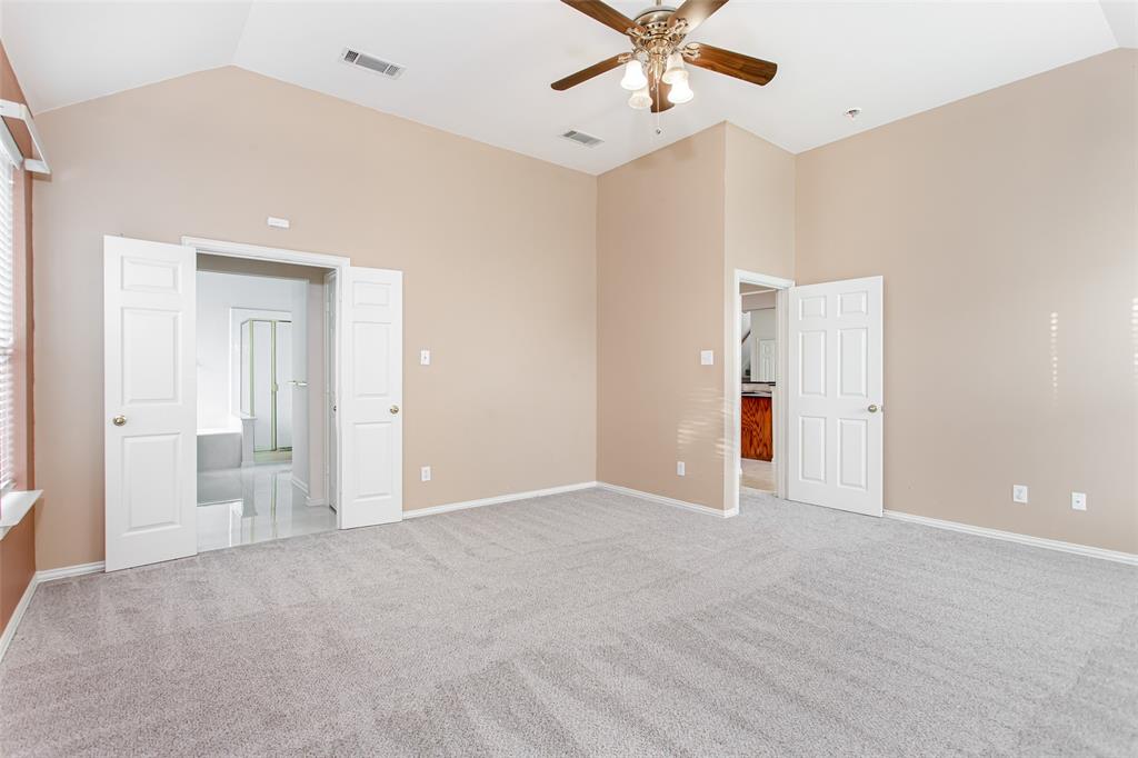 915 Falcon Trail Murphy, TX 75094 - Photo 26 of 40 an empty room with fan and entrance