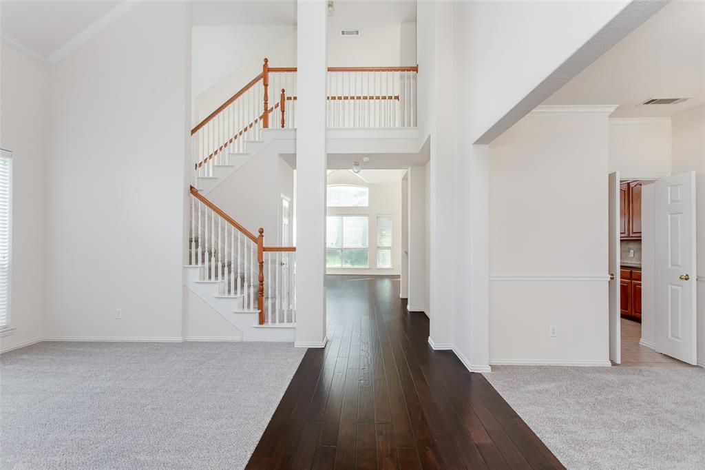 915 Falcon Trail Murphy, TX 75094 - Photo 3 of 40 a view of a hallway with wooden floor and entryway