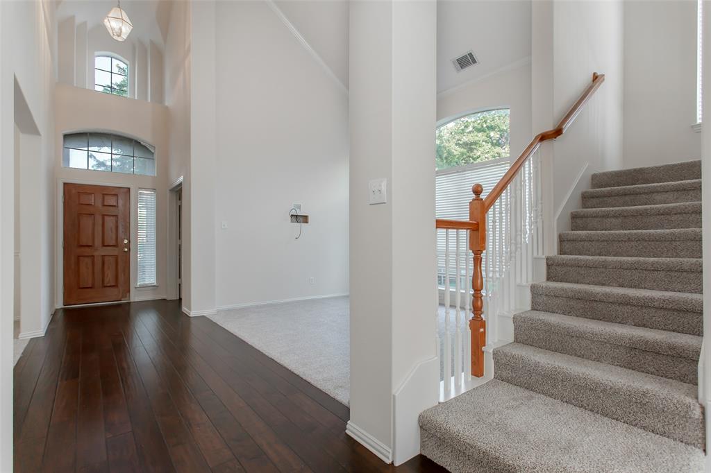 915 Falcon Trail Murphy, TX 75094 - Photo 31 of 40 a view of entryway and hall with wooden floor