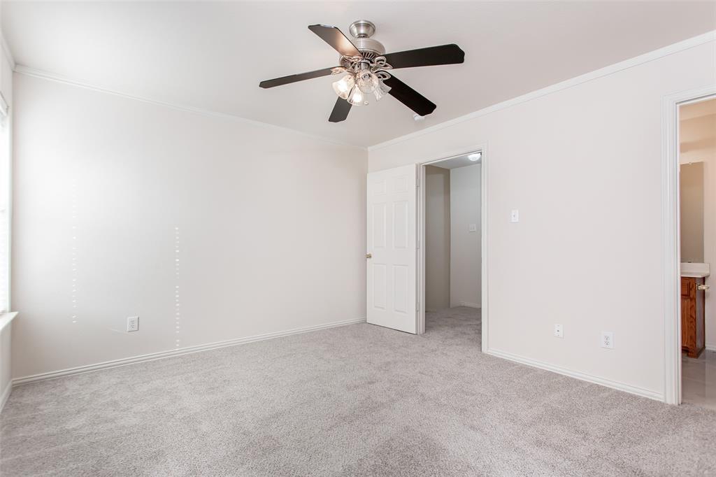 915 Falcon Trail Murphy, TX 75094 - Photo 36 of 40 an empty room with a ceiling fan and a window