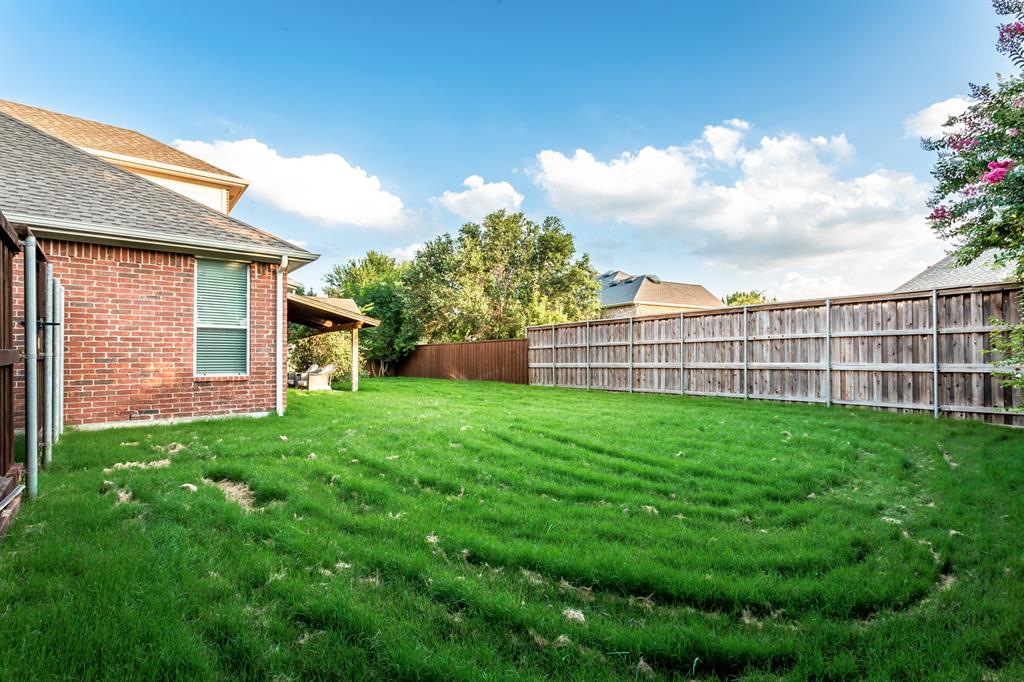 915 Falcon Trail Murphy, TX 75094 - Photo 40 of 40 a view of a backyard with a garden
