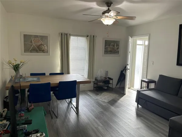 a living room with furniture or couch and a chandelier
