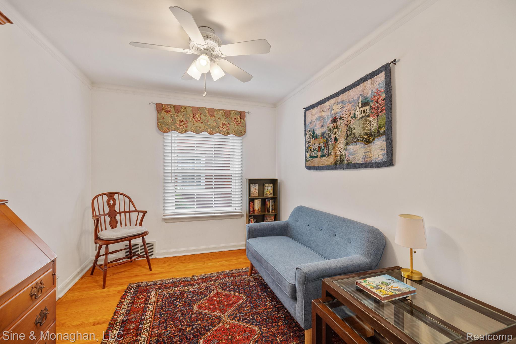 679 Neff Road Grosse Pointe, MI 48230 - Photo 28 of 78 Hardwood flooring, crown molding, white walls, window with blinds, and a ceiling fan with light fixture