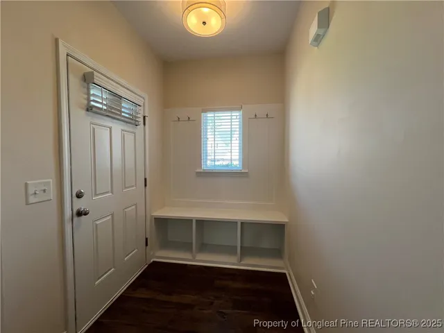 a view of room with window and hardwood floor