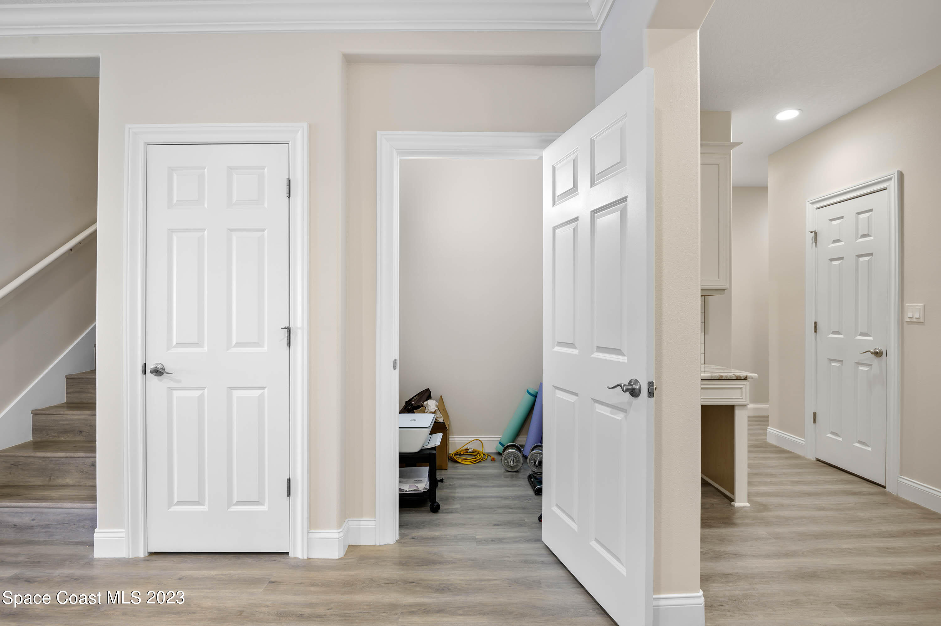 2240 Enjoya Lane Melbourne, FL 32901 - Photo 11 of 31 a view of a hallway with closet and wooden floor