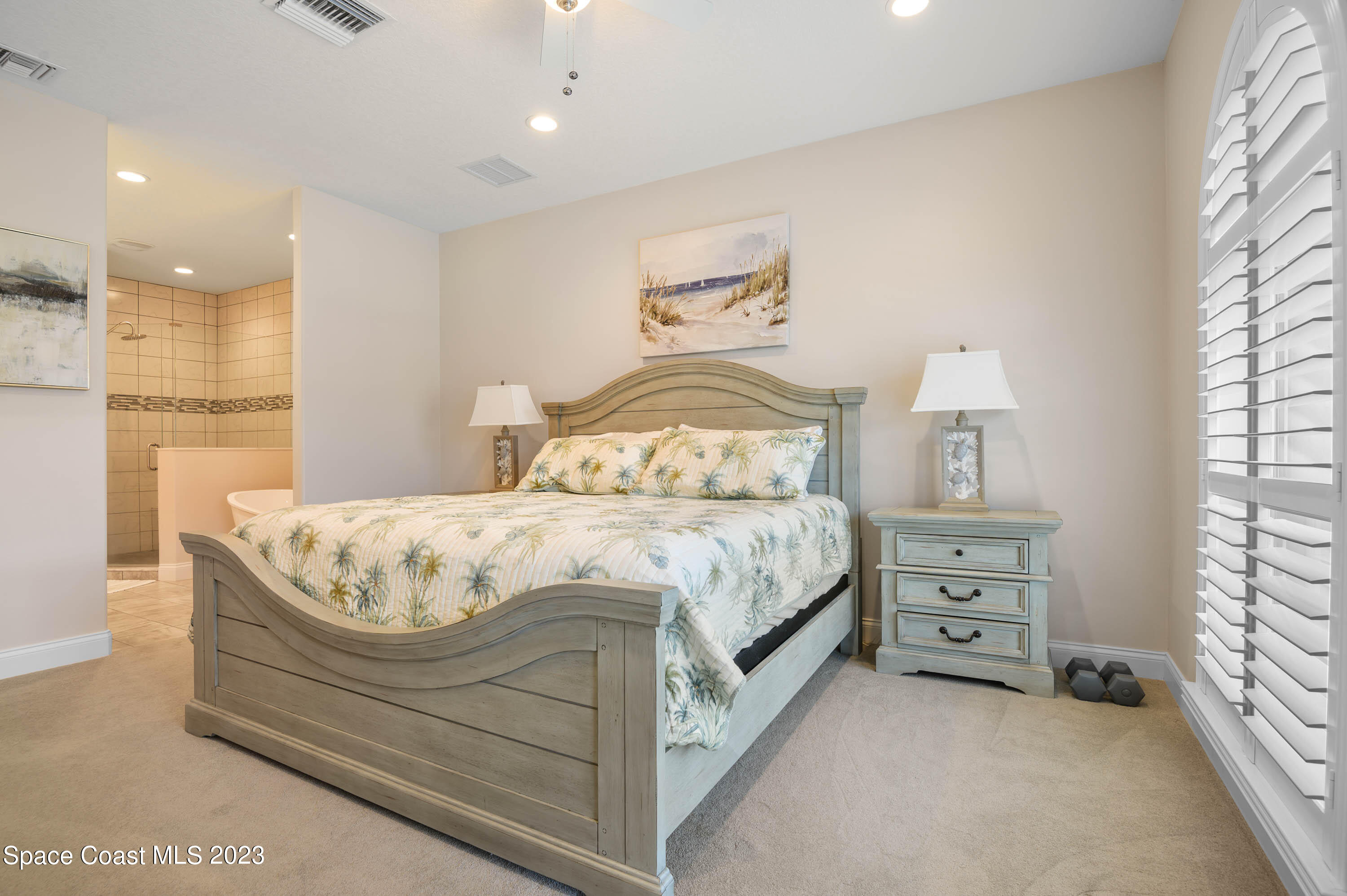 2240 Enjoya Lane Melbourne, FL 32901 - Photo 13 of 31 a bedroom with a bed and a window