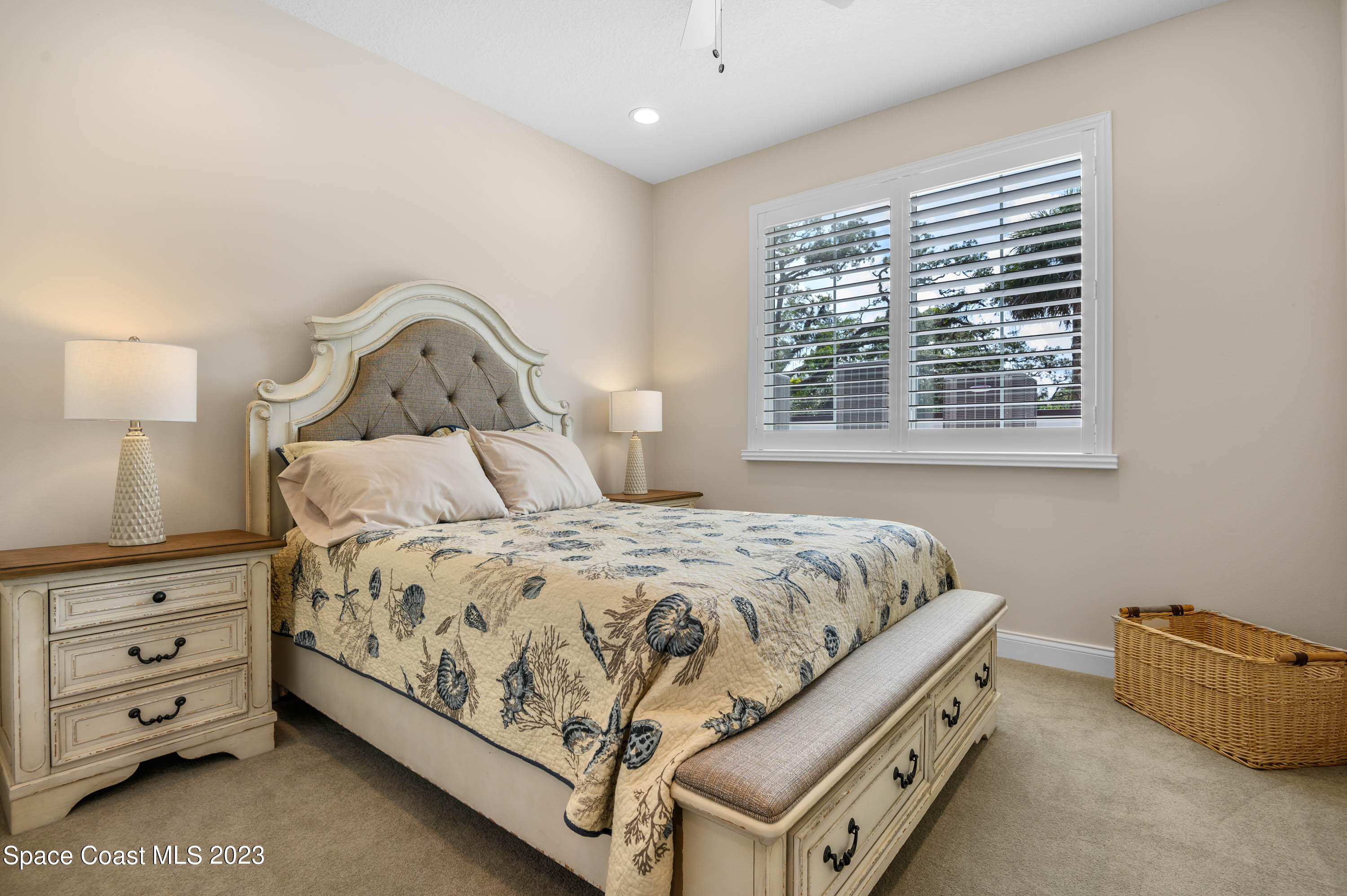 2240 Enjoya Lane Melbourne, FL 32901 - Photo 18 of 31 a bedroom with a bed and a dresser