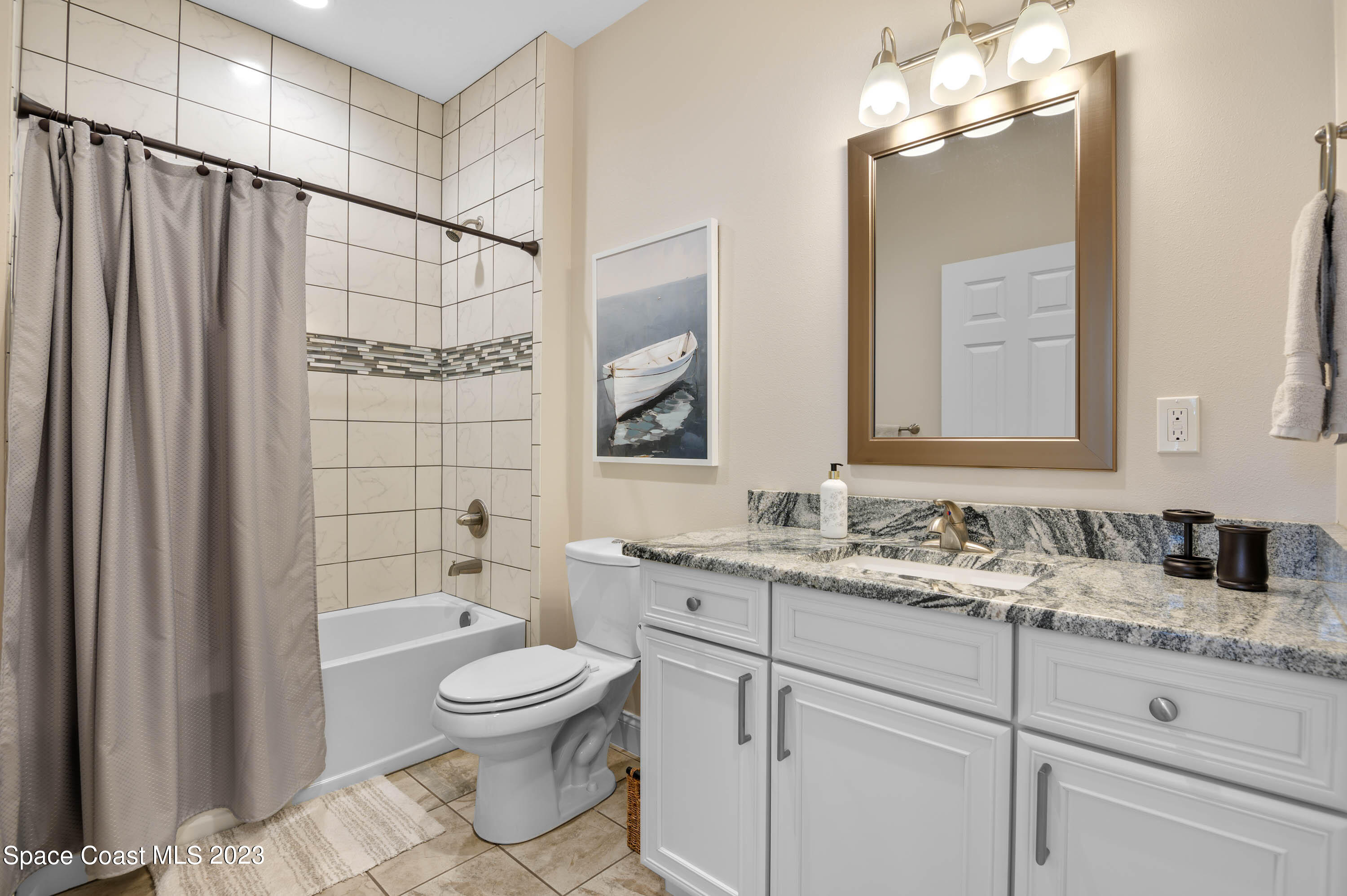 2240 Enjoya Lane Melbourne, FL 32901 - Photo 19 of 31 a bathroom with a toilet sink and mirror