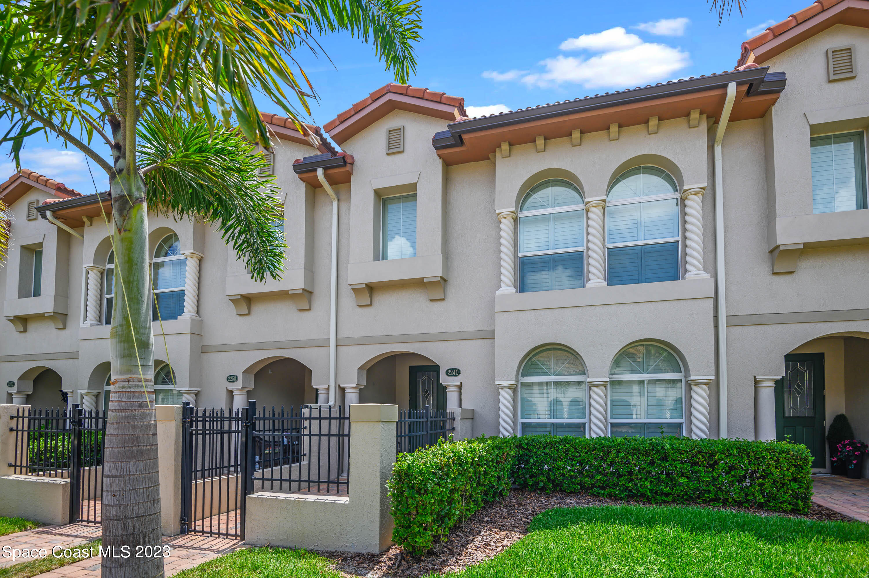 2240 Enjoya Lane Melbourne, FL 32901 - Photo 2 of 31 a front view of a house with balcony