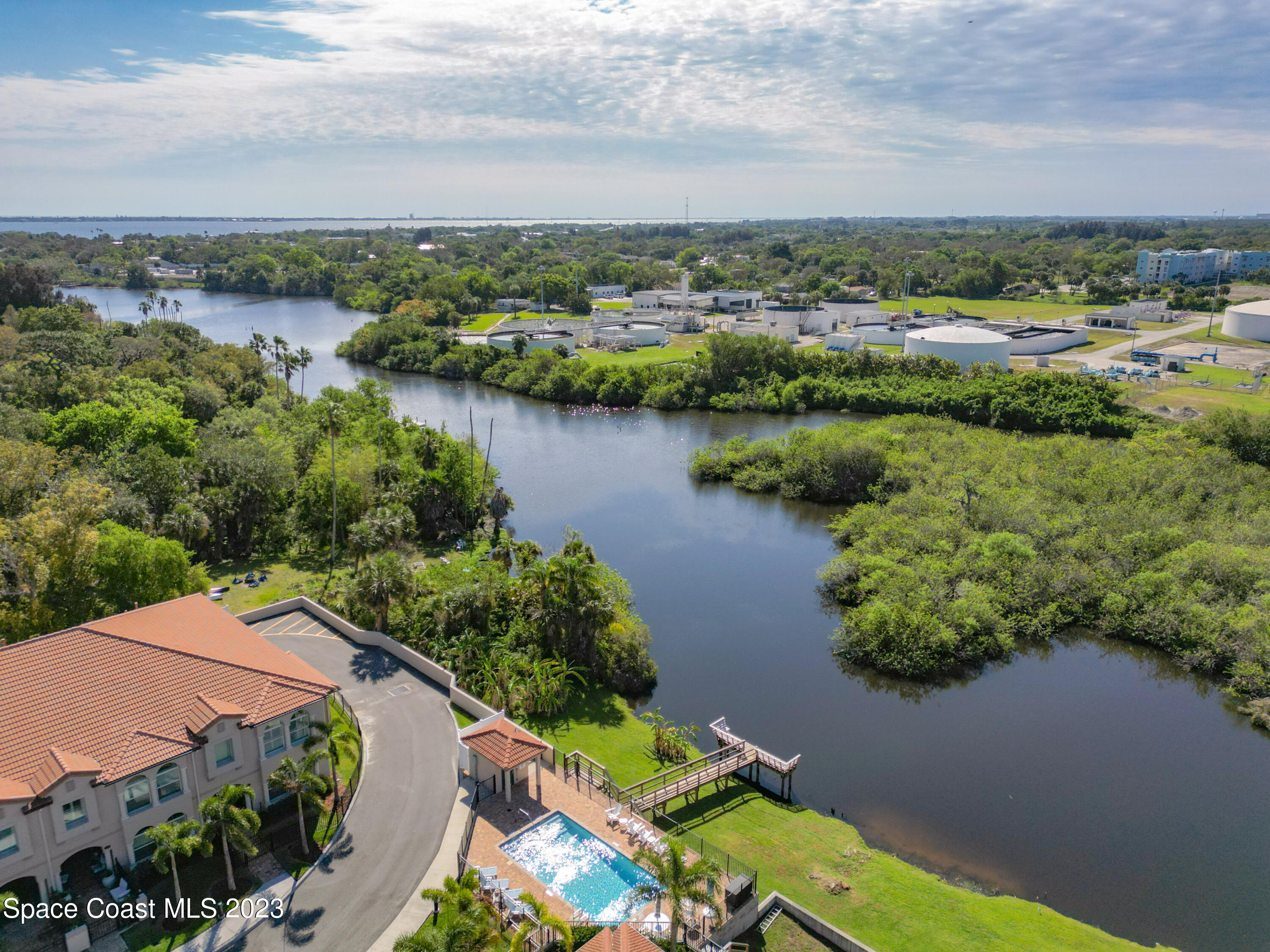 2240 Enjoya Lane Melbourne, FL 32901 - Photo 24 of 31 a view of a lake with a city