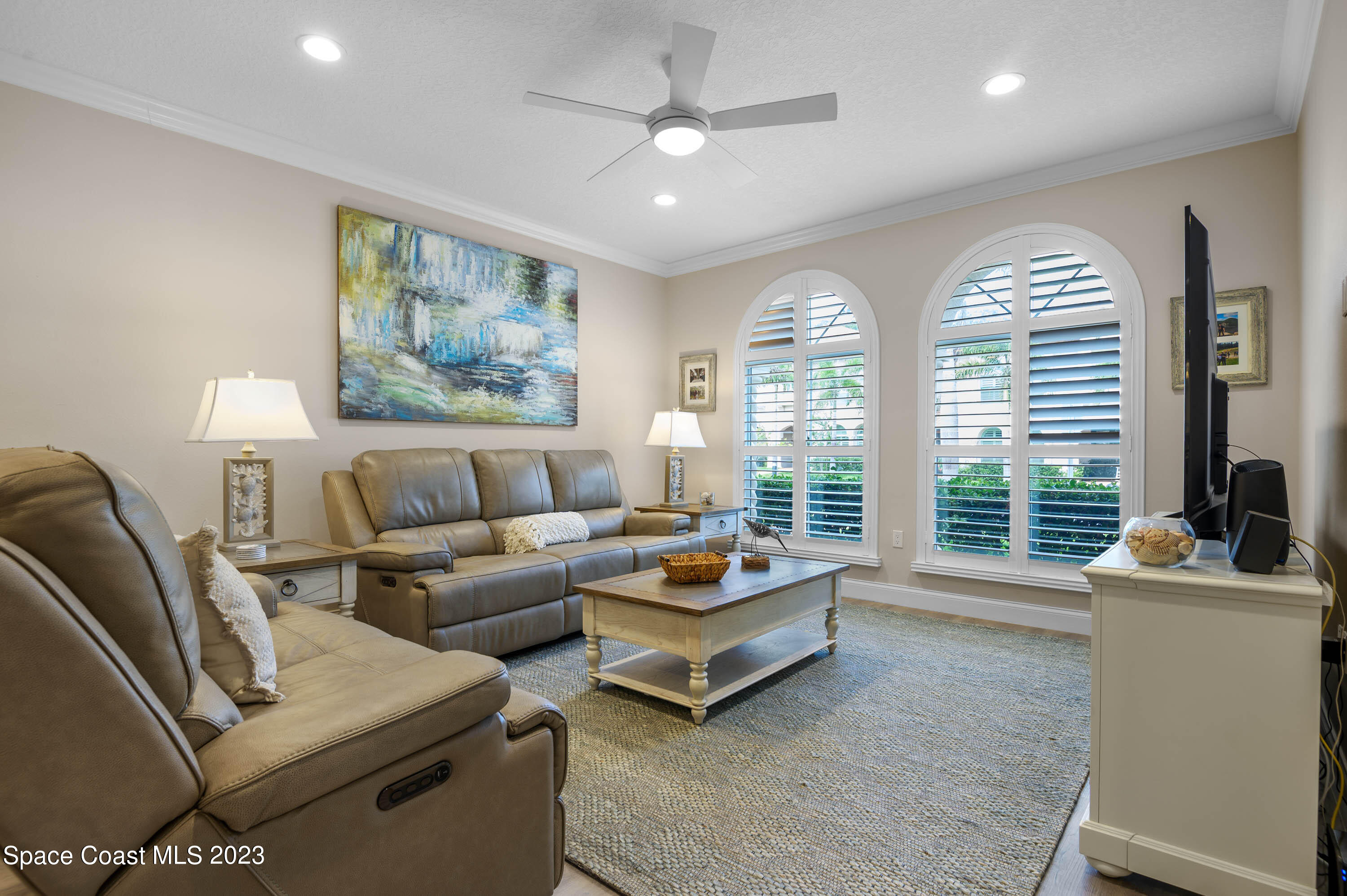2240 Enjoya Lane Melbourne, FL 32901 - Photo 4 of 31 a living room with furniture and a large window