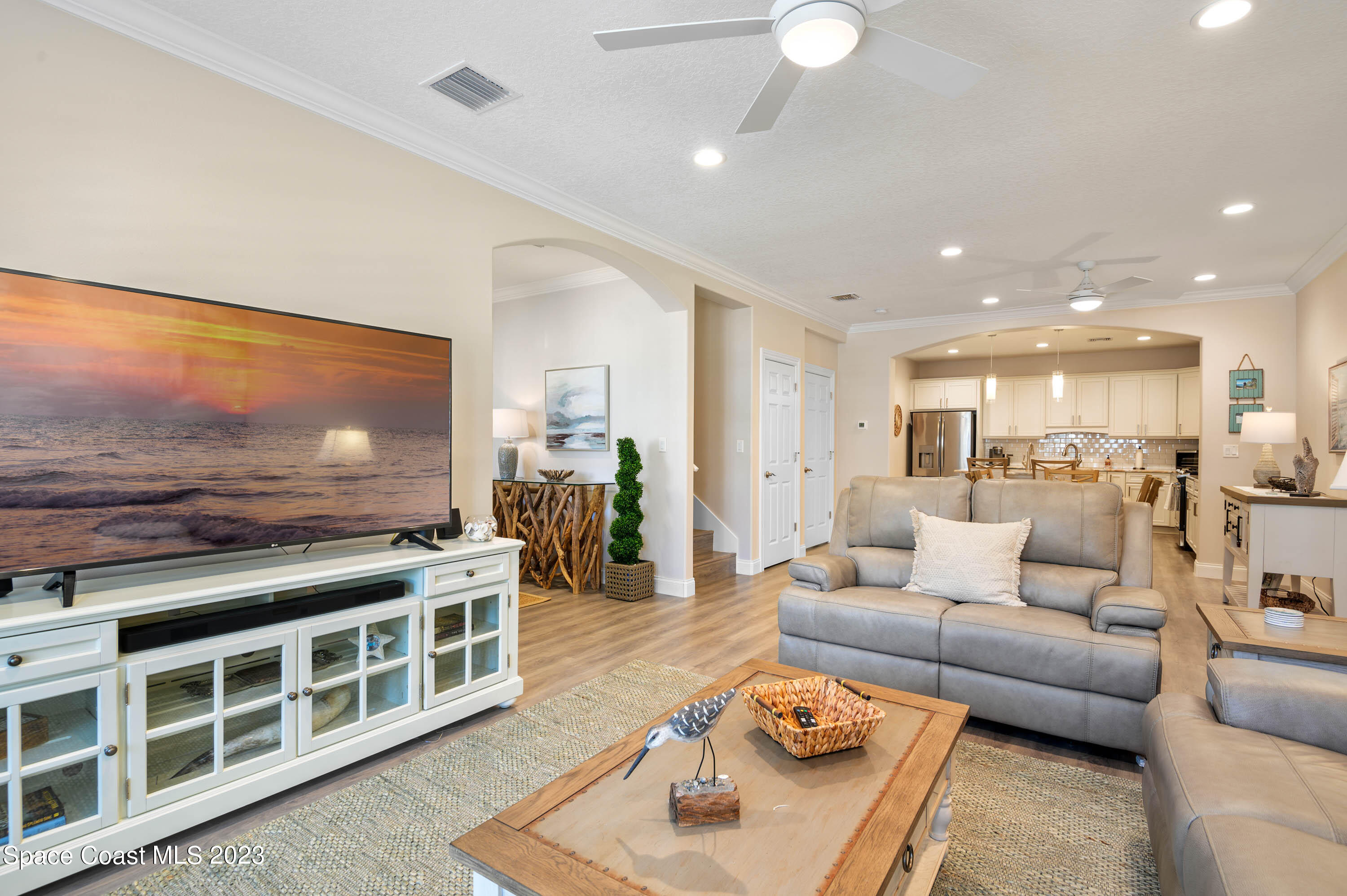 2240 Enjoya Lane Melbourne, FL 32901 - Photo 5 of 31 a living room with furniture and a flat screen tv