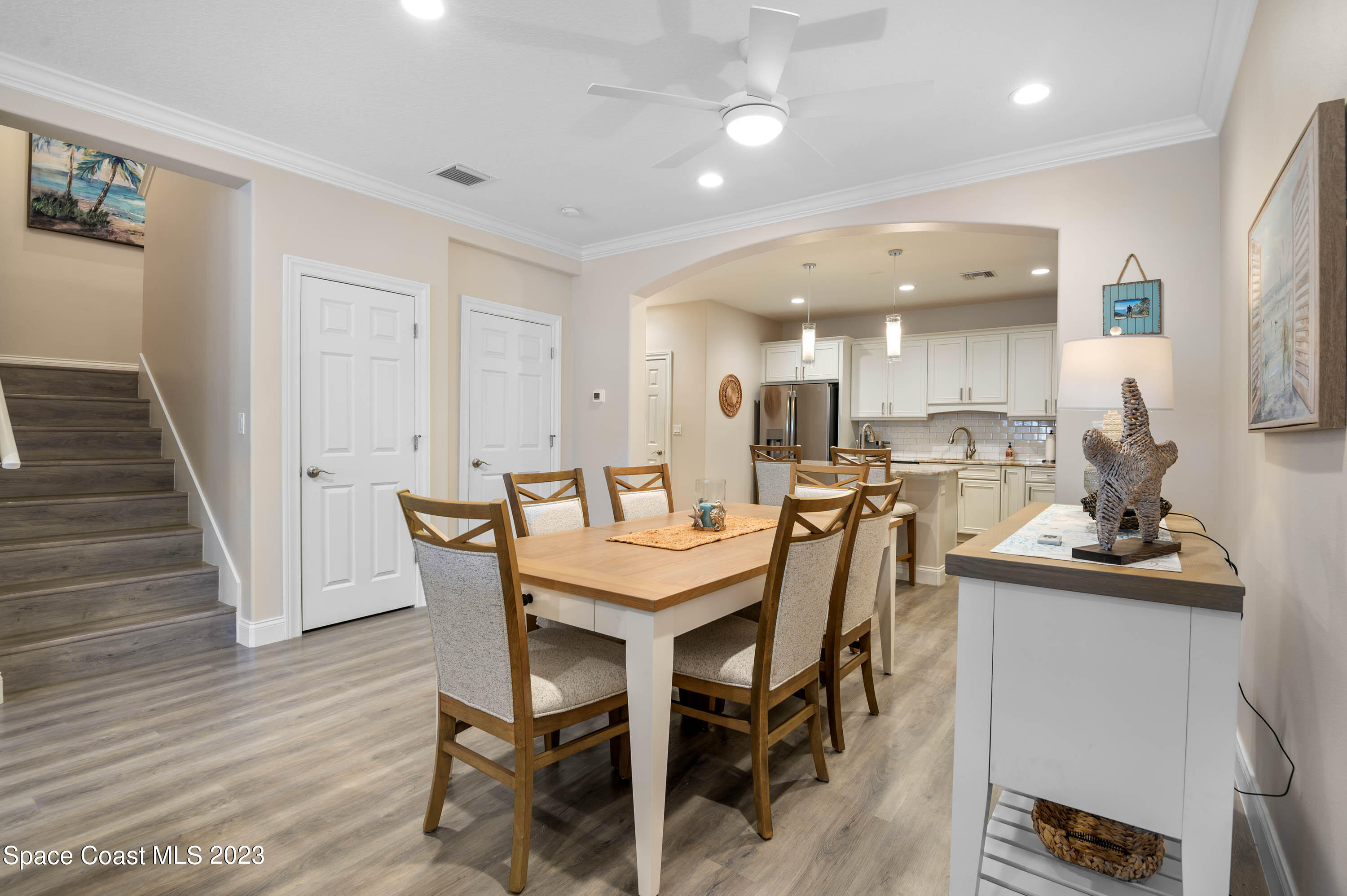 2240 Enjoya Lane Melbourne, FL 32901 - Photo 6 of 31 a dining room with furniture and wooden floor