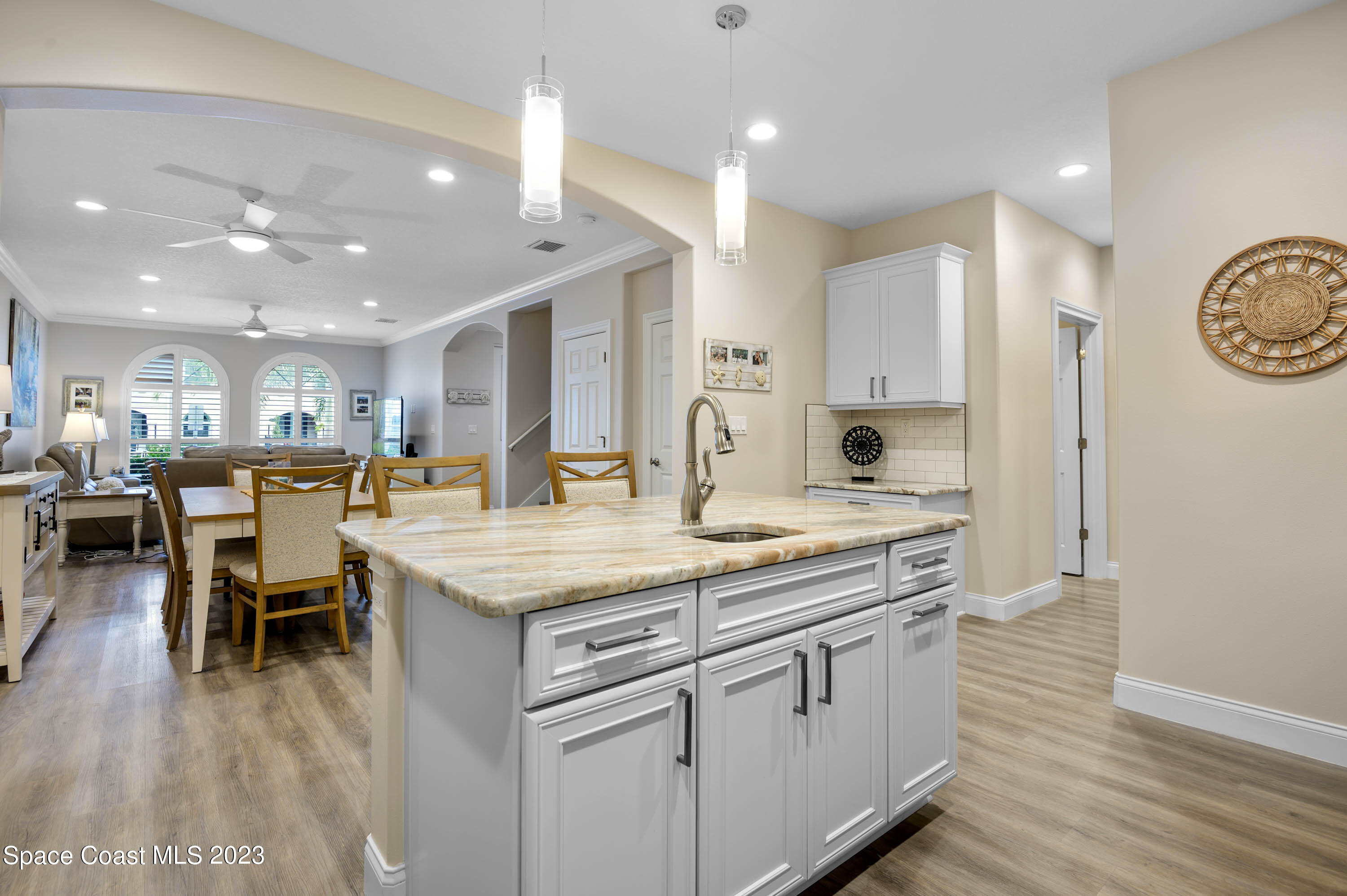 2240 Enjoya Lane Melbourne, FL 32901 - Photo 9 of 31 a kitchen with a table and chairs