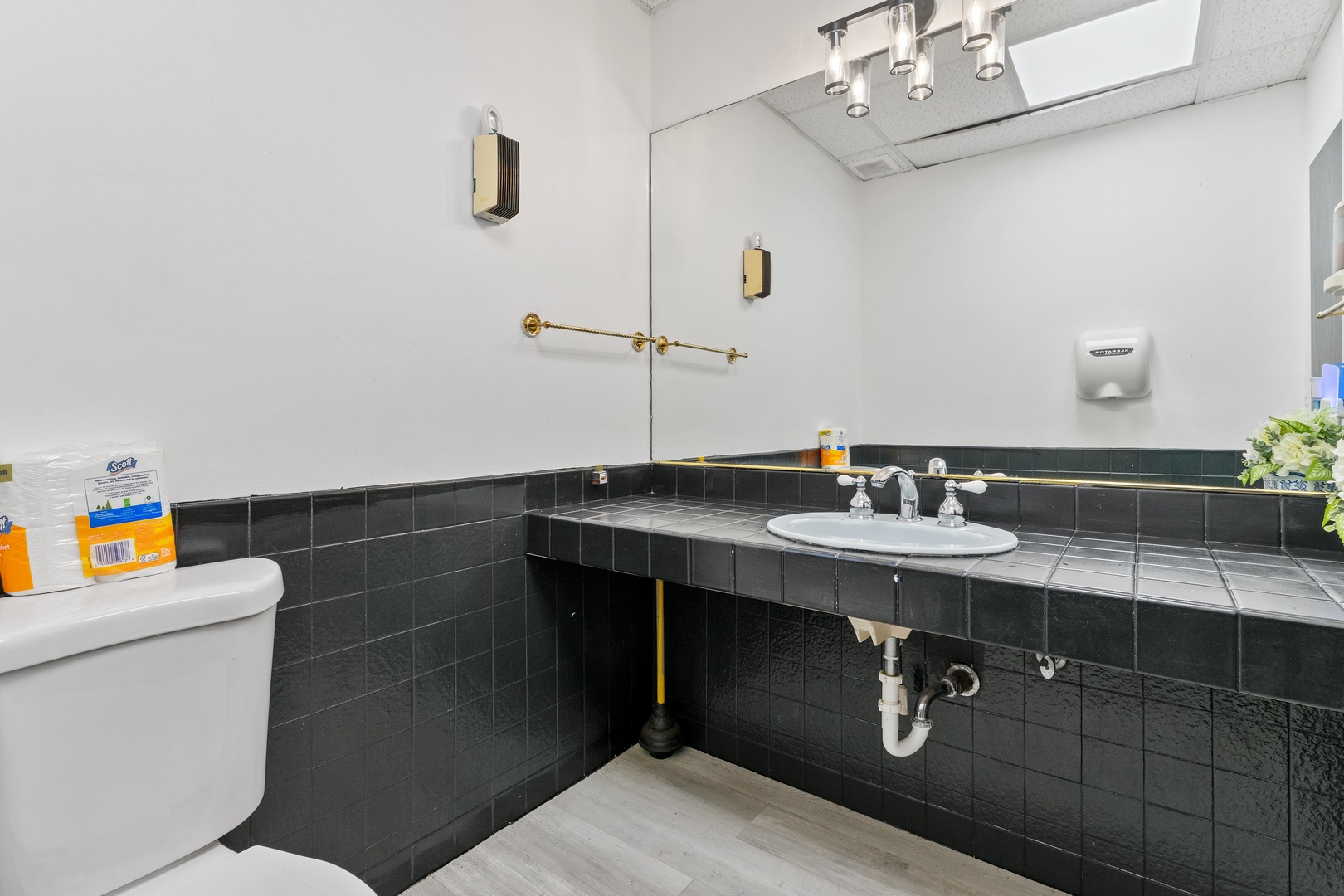 5744 West Irving Park Road Chicago, IL 60634 - Photo 14 of 17 a bathroom with a sink toilet and a mirror