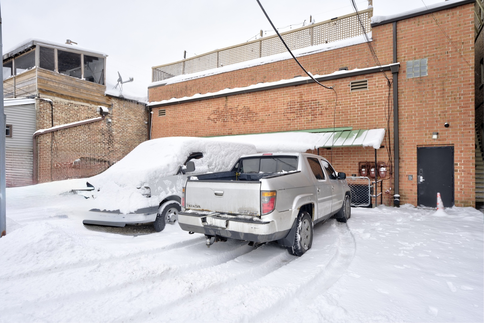5744 West Irving Park Road Chicago, IL 60634 - Photo 17 of 17 a white car parked in front of a house