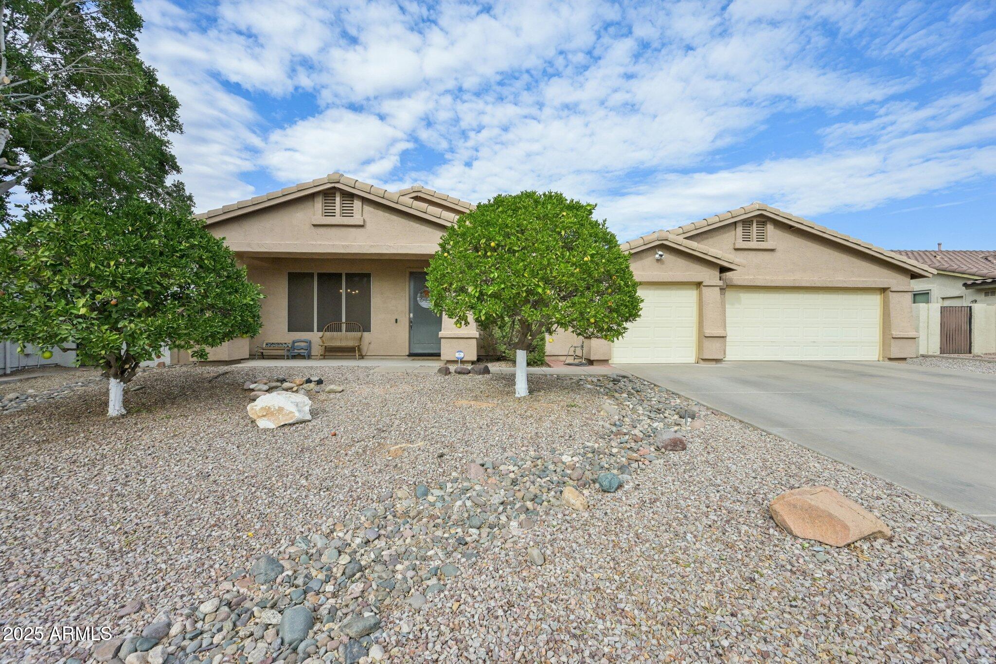 a front view of a house with garden