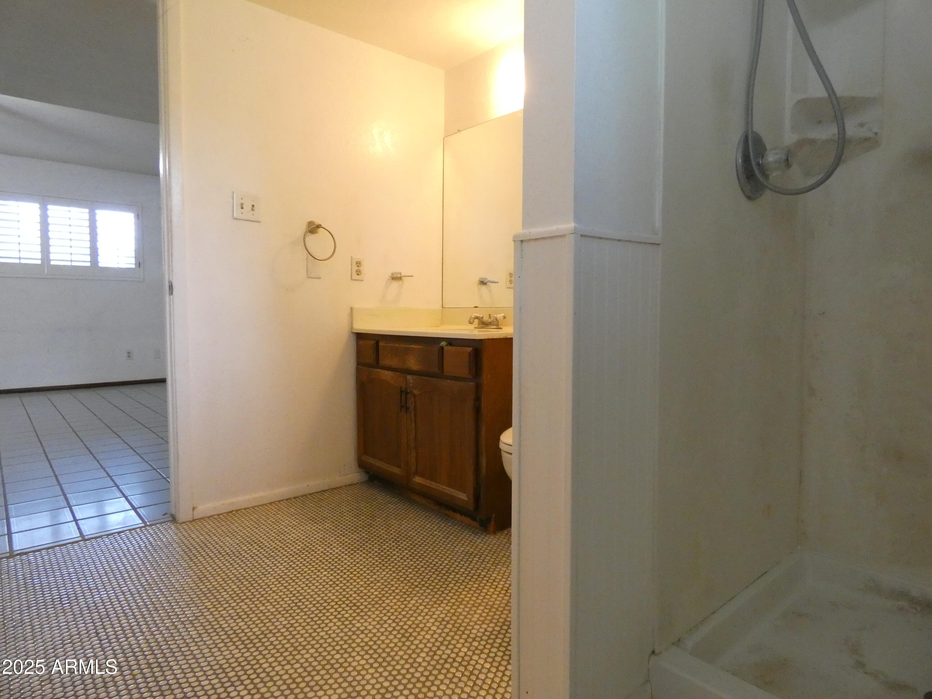 3214 West State Avenue Phoenix, AZ 85051 - Photo 14 of 35 a bathroom with a sink and a mirror