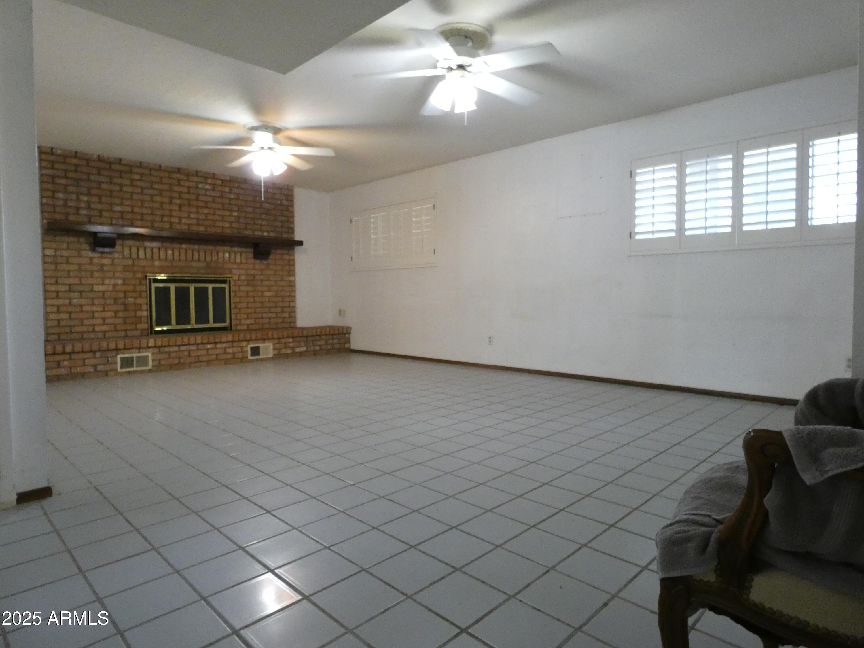 3214 West State Avenue Phoenix, AZ 85051 - Photo 15 of 35 a view of a livingroom with furniture and chandelier fan