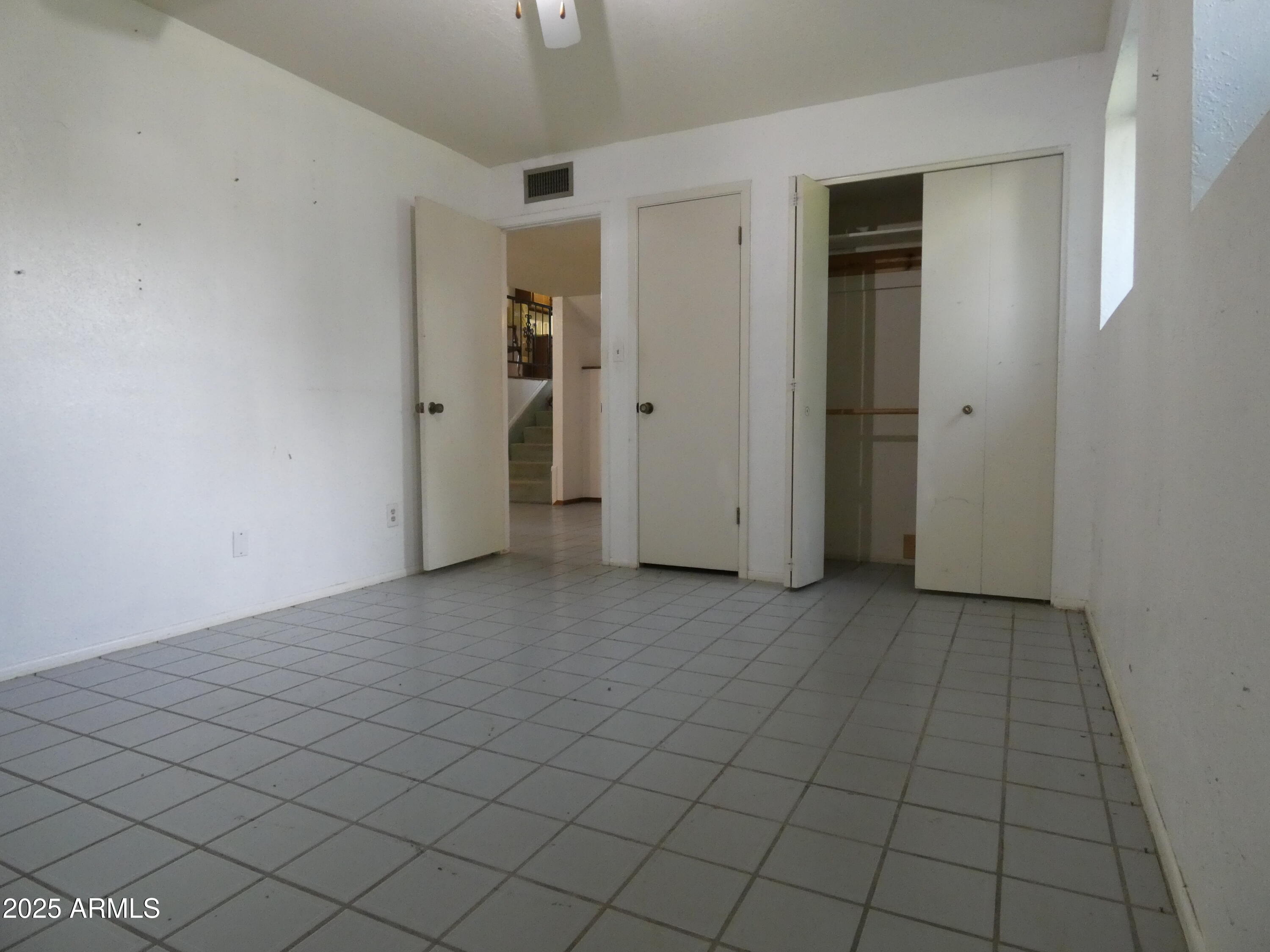 3214 West State Avenue Phoenix, AZ 85051 - Photo 17 of 35 an empty room with windows